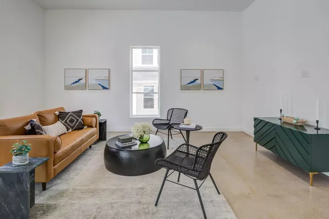 a living room with furniture and a window