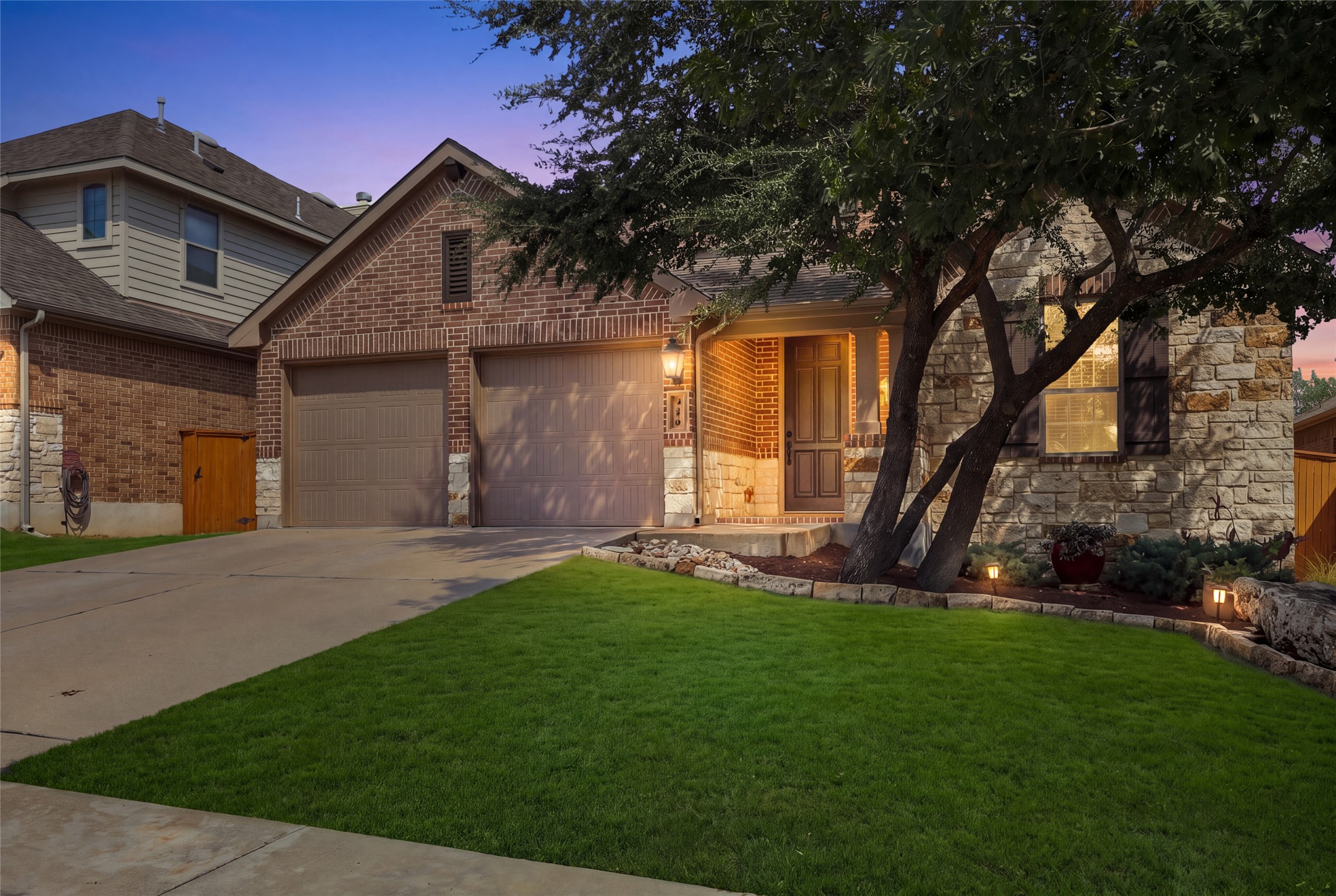 320 Fort Cobb Way Georgetown, TX 78628 - Photo 1 of 37 Textured stone and classic brick accent the exterior of this lovely home with a manicured lawn.