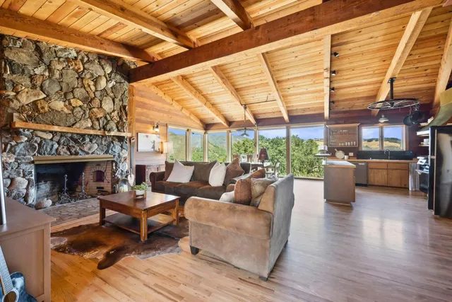 a dining room with furniture window and wooden floor