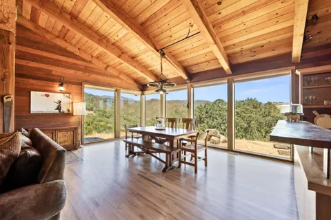 a view of a patio with a table and chairs