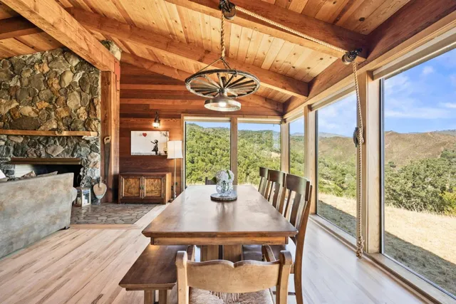 a kitchen view of a kitchen island wooden cabinets and stainless steel appliances