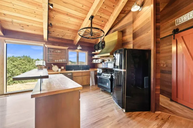 a bedroom with a bed and a fireplace