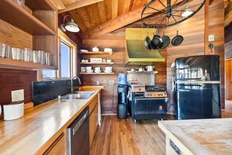 a view of a balcony with a table and chairs