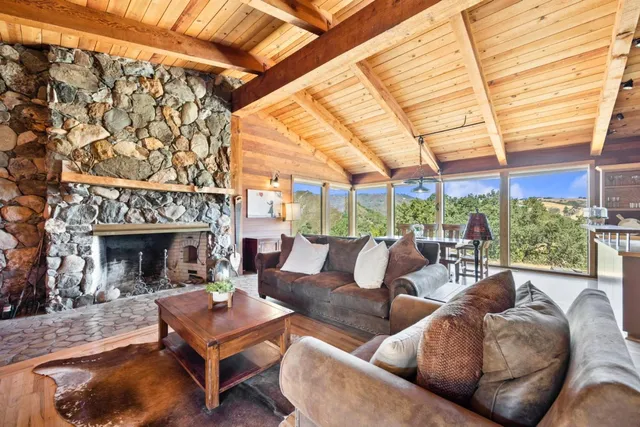 a spacious bathroom with a double vanity sink mirror and bathtub