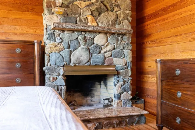 a bedroom with a bed and a balcony view