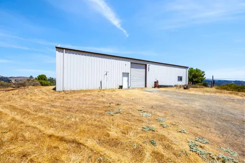a view of a city with mountains in the background