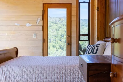 a bedroom with bed and window