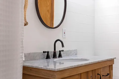 a view of a house with snow on the road