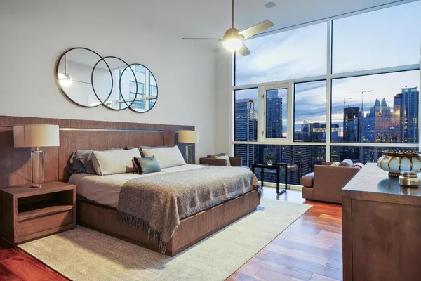 a bed room with a bed and dresser