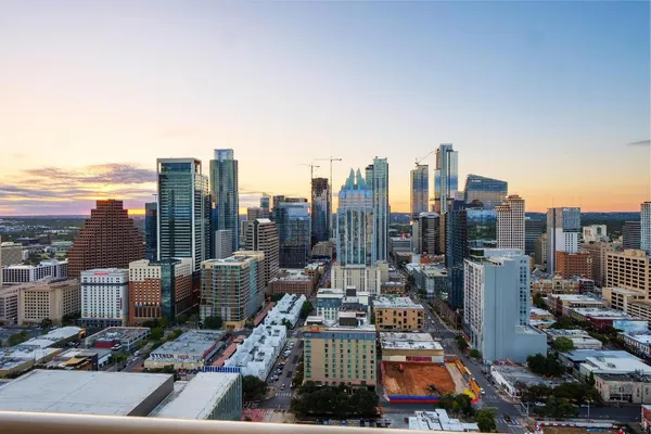 a view of a balcony with city view