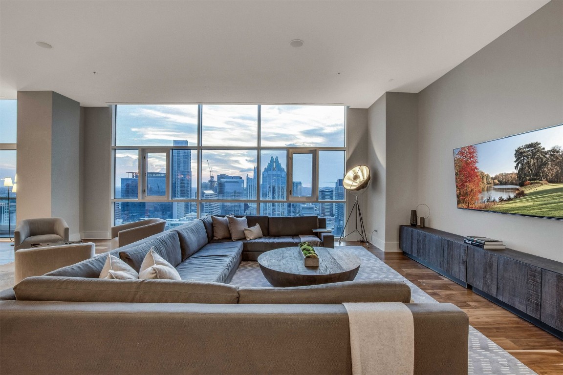 555 East 5th Street, Unit 3022 Austin, TX 78701 - Photo 7 of 40 a living room with furniture and large windows