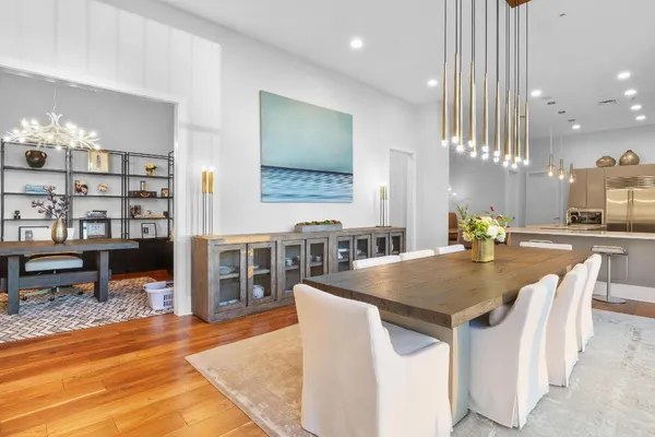 a dining table with kitchen view