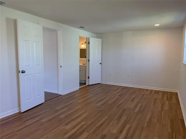 a white toilet and shower