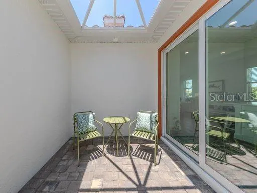 a view of a room with furniture and wooden floor