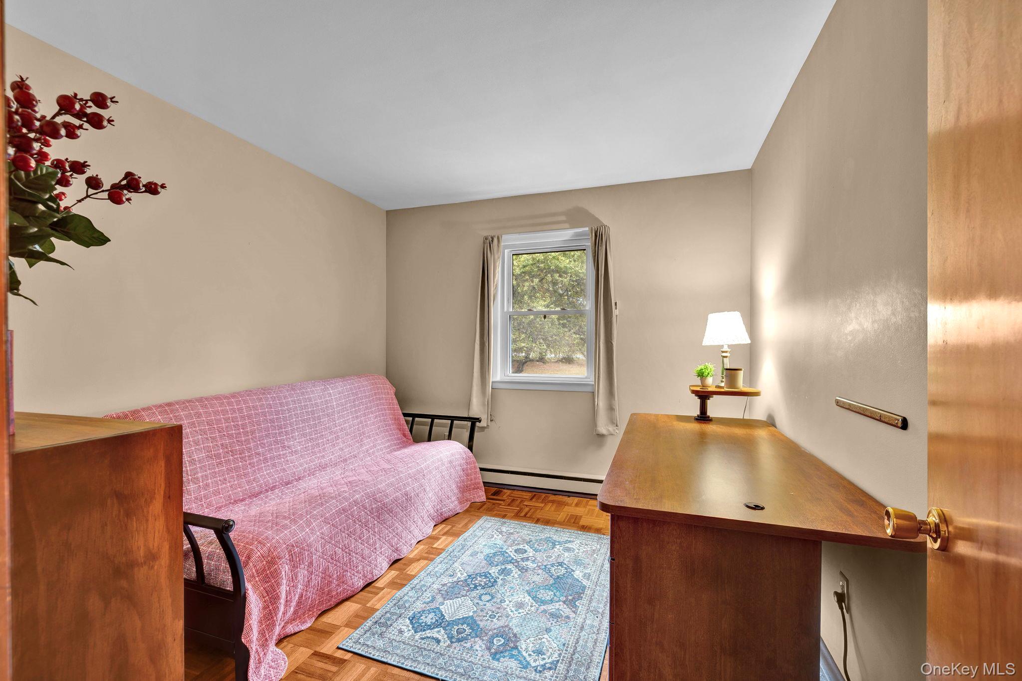 148 Moore Road Woodbourne, NY 12788 - Photo 13 of 36 a bedroom with furniture and a wooden floor
