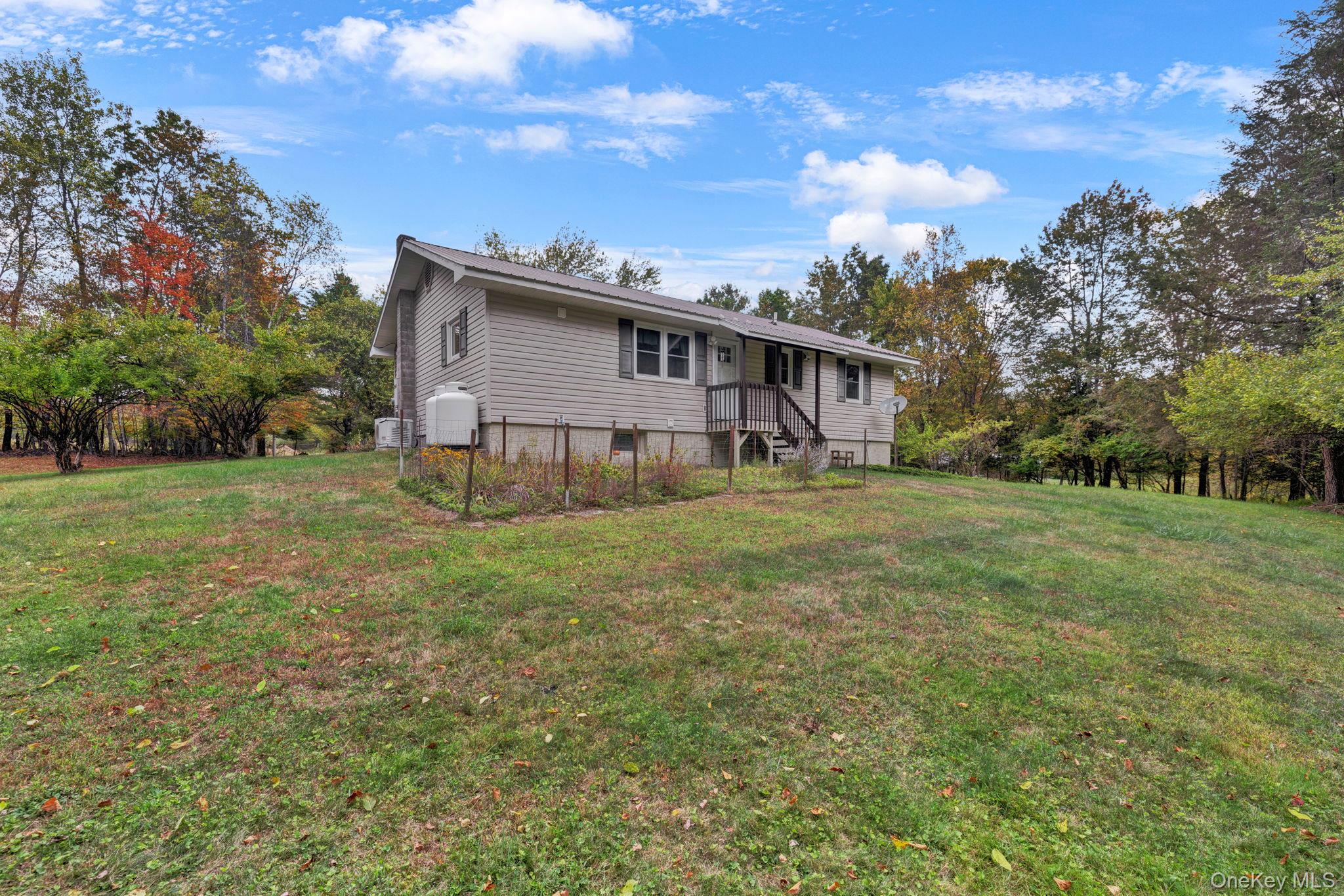 148 Moore Road Woodbourne, NY 12788 - Photo 27 of 36 a house view with a garden space