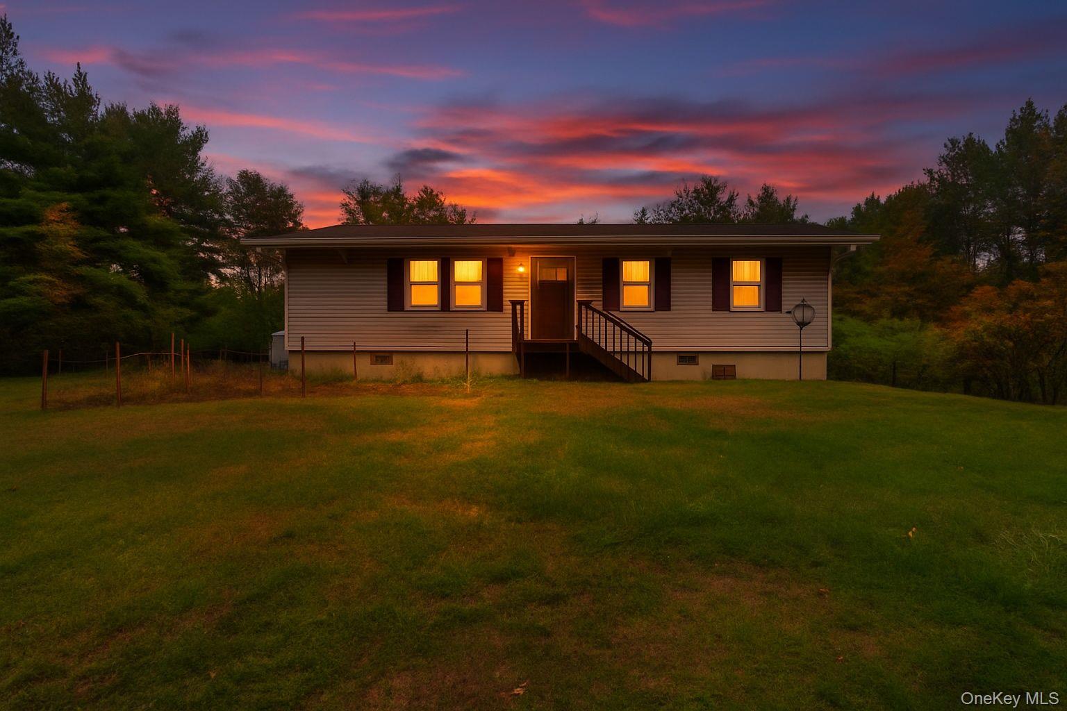148 Moore Road Woodbourne, NY 12788 - Photo 33 of 36 a view of a yard in front of a house with a yard