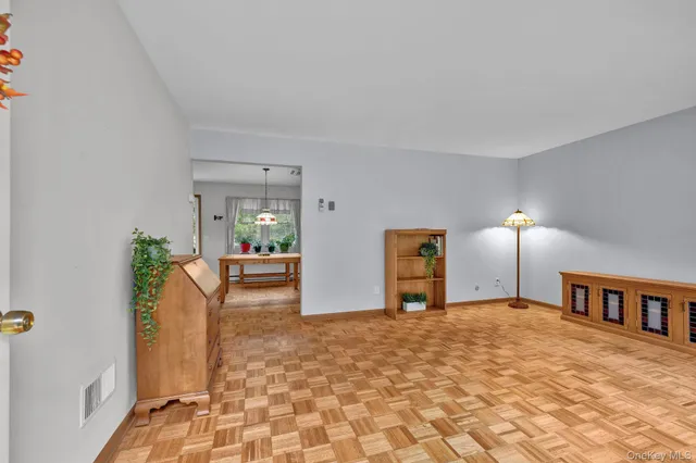 a bedroom with furniture and a lamp