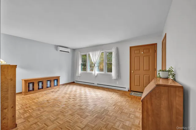 a view of an empty room and window