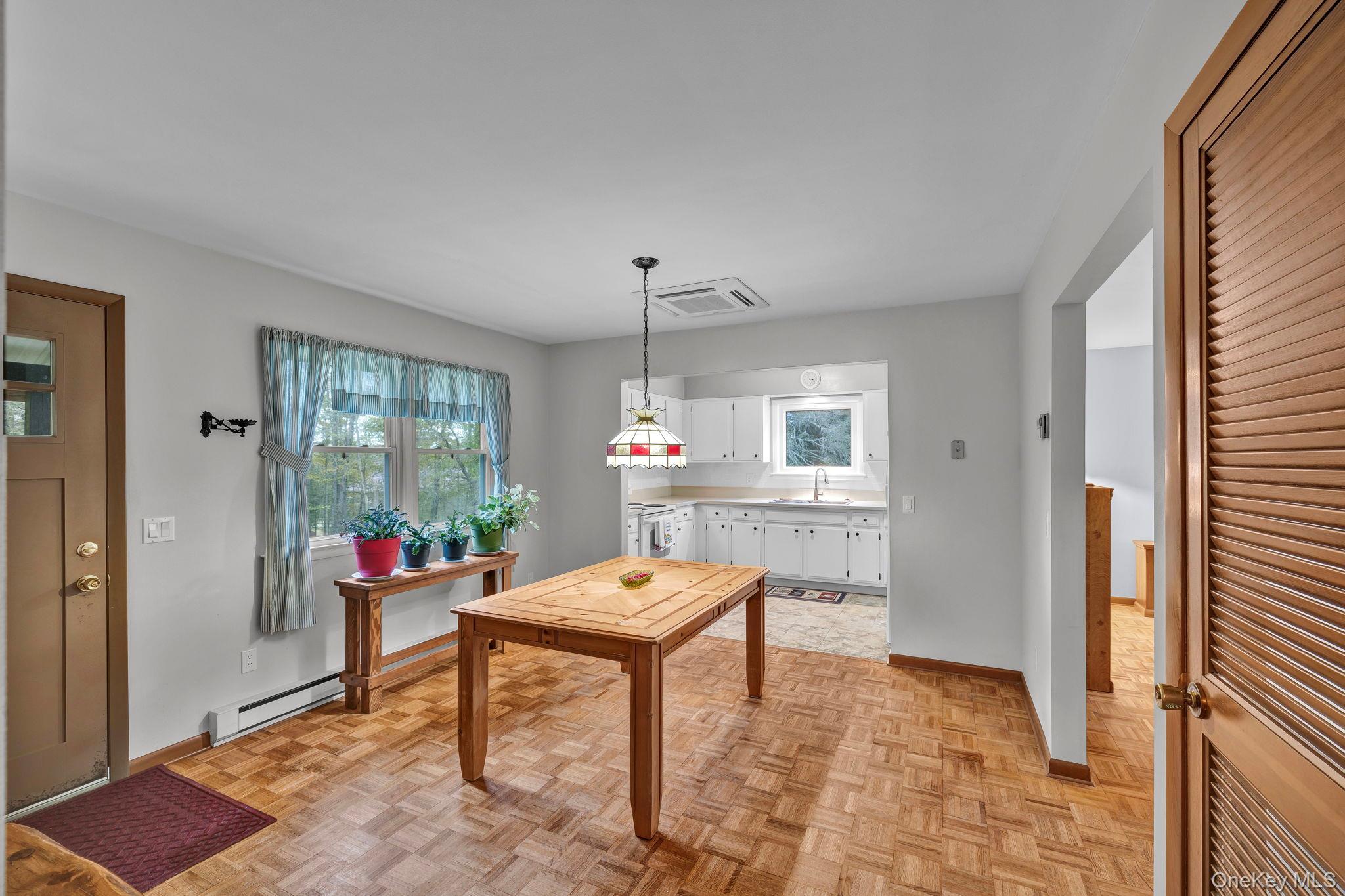 148 Moore Road Woodbourne, NY 12788 - Photo 9 of 36 a dining room with a table and chairs