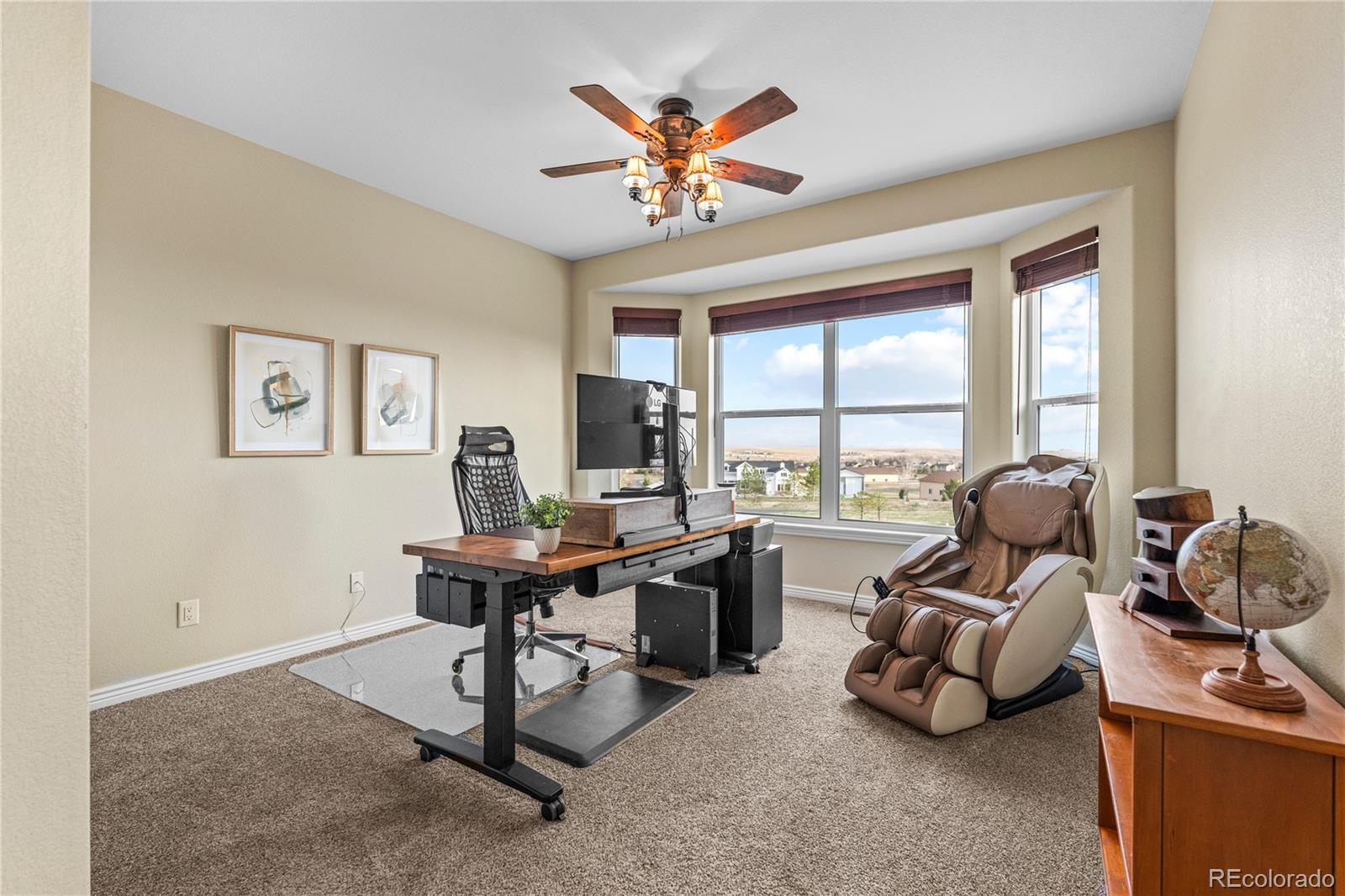 41900 East Muirfield Loop Elizabeth, CO 80107 - Photo 21 of 26 a work room with furniture and large windows