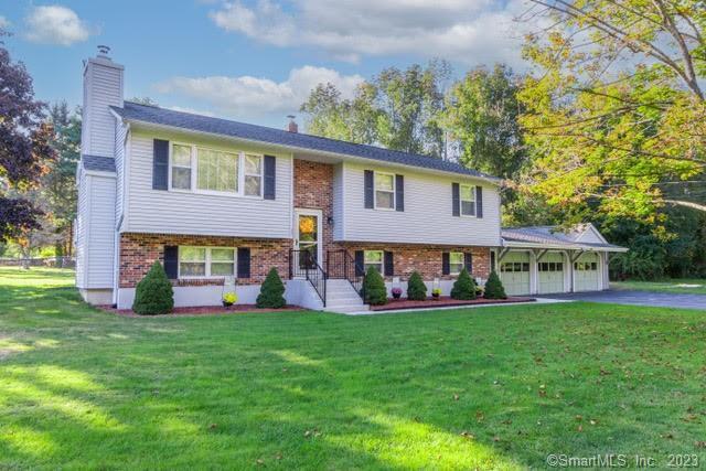 77 Doyle Road Montville, CT 06370 - Photo 1 of 1 a view of a house with a yard and sitting area