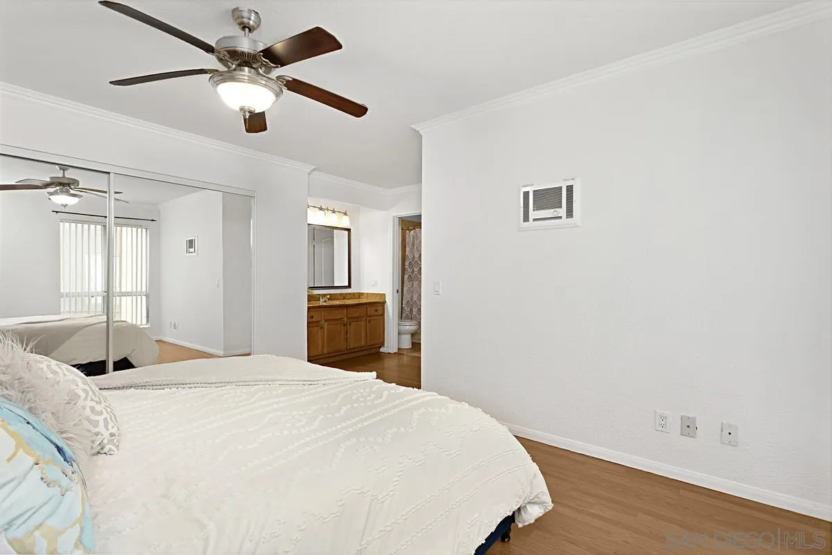 615 Fredricks Avenue, Unit 159 Oceanside, CA 92058 - Photo 18 of 26 a bed room with a bed and a television