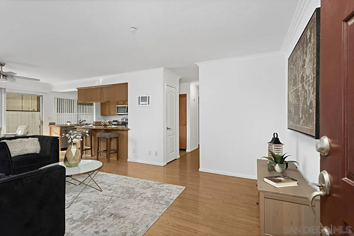 615 Fredricks Avenue, Unit 159 Oceanside, CA 92058 - Photo 5 of 26 a living room with furniture and kitchen view