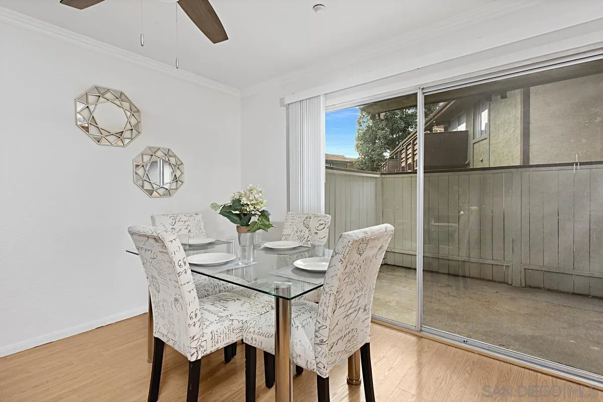 615 Fredricks Avenue, Unit 159 Oceanside, CA 92058 - Photo 9 of 26 a dining room with furniture and window
