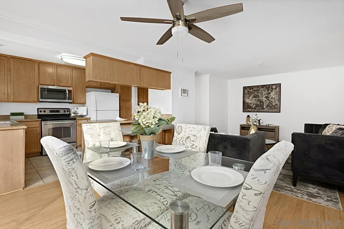 615 Fredricks Avenue, Unit 159 Oceanside, CA 92058 - Photo 10 of 26 a dining room with furniture a window and kitchen view