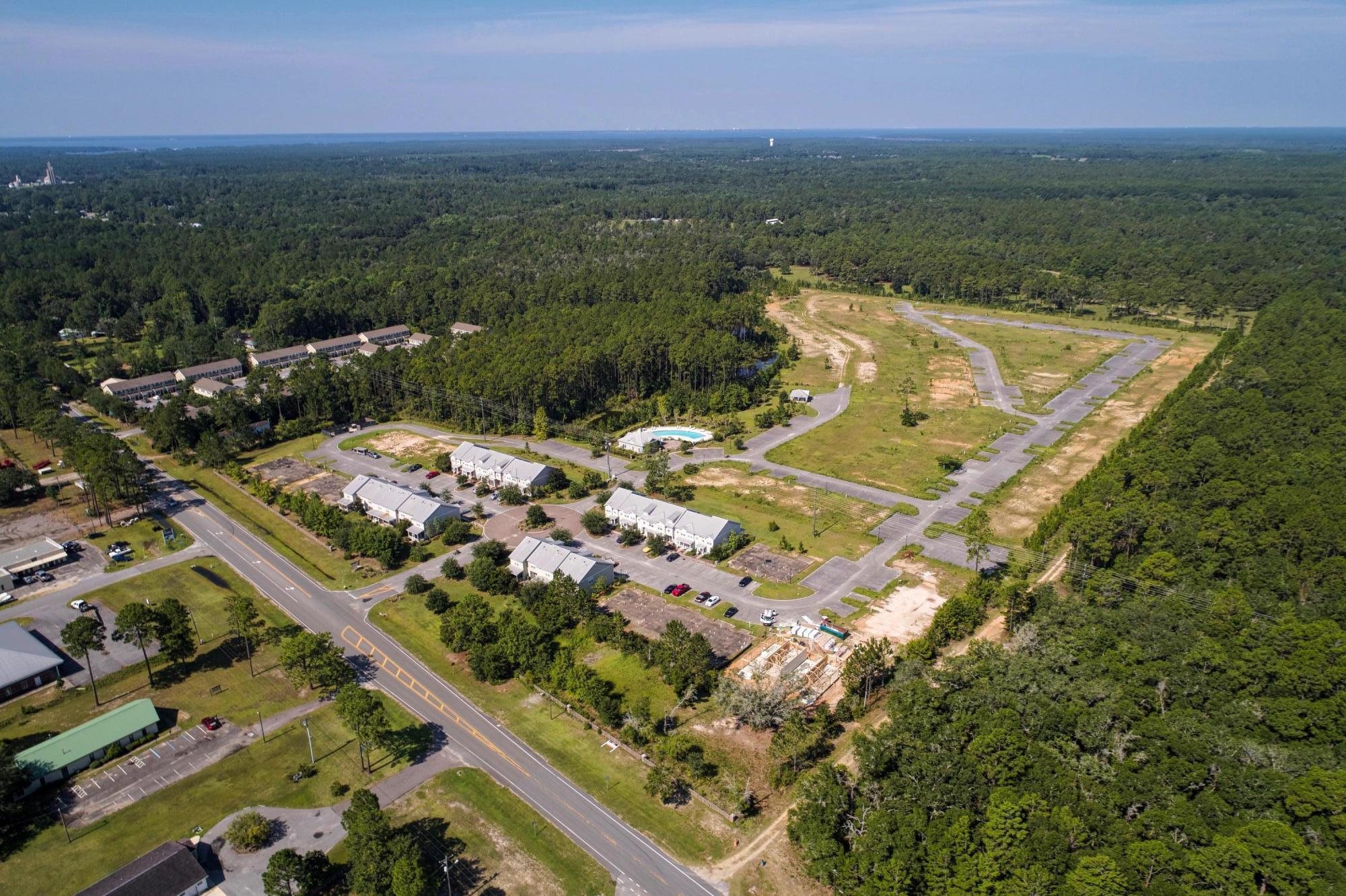 58 South Sand Palm Road, Unit LOT 40 Freeport, FL 32439 - Photo 21 of 34 a view of a city with an ocean