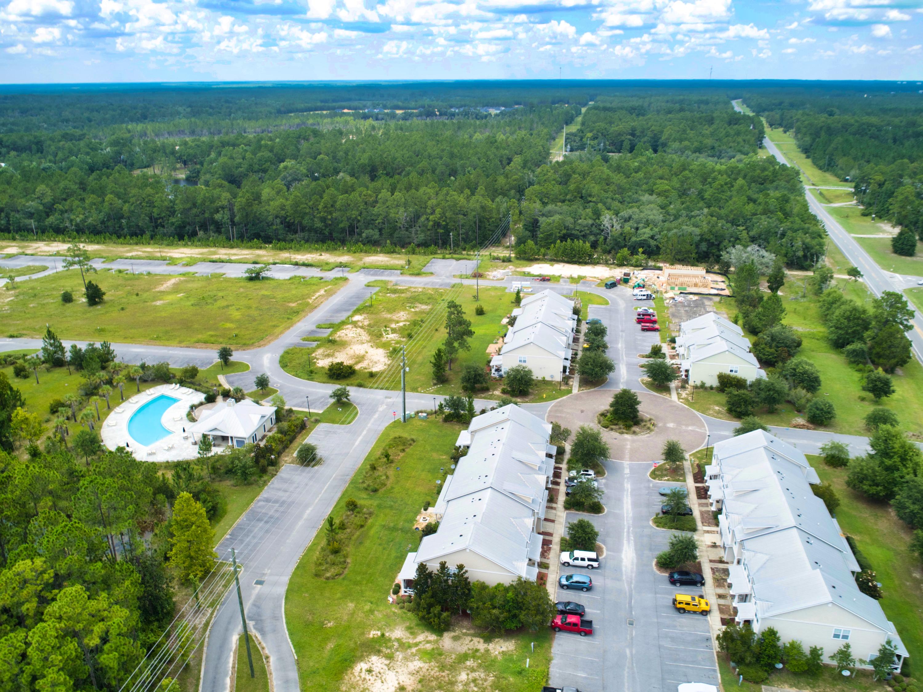 58 South Sand Palm Road, Unit LOT 40 Freeport, FL 32439 - Photo 3 of 34 a view of a swimming pool with a yard