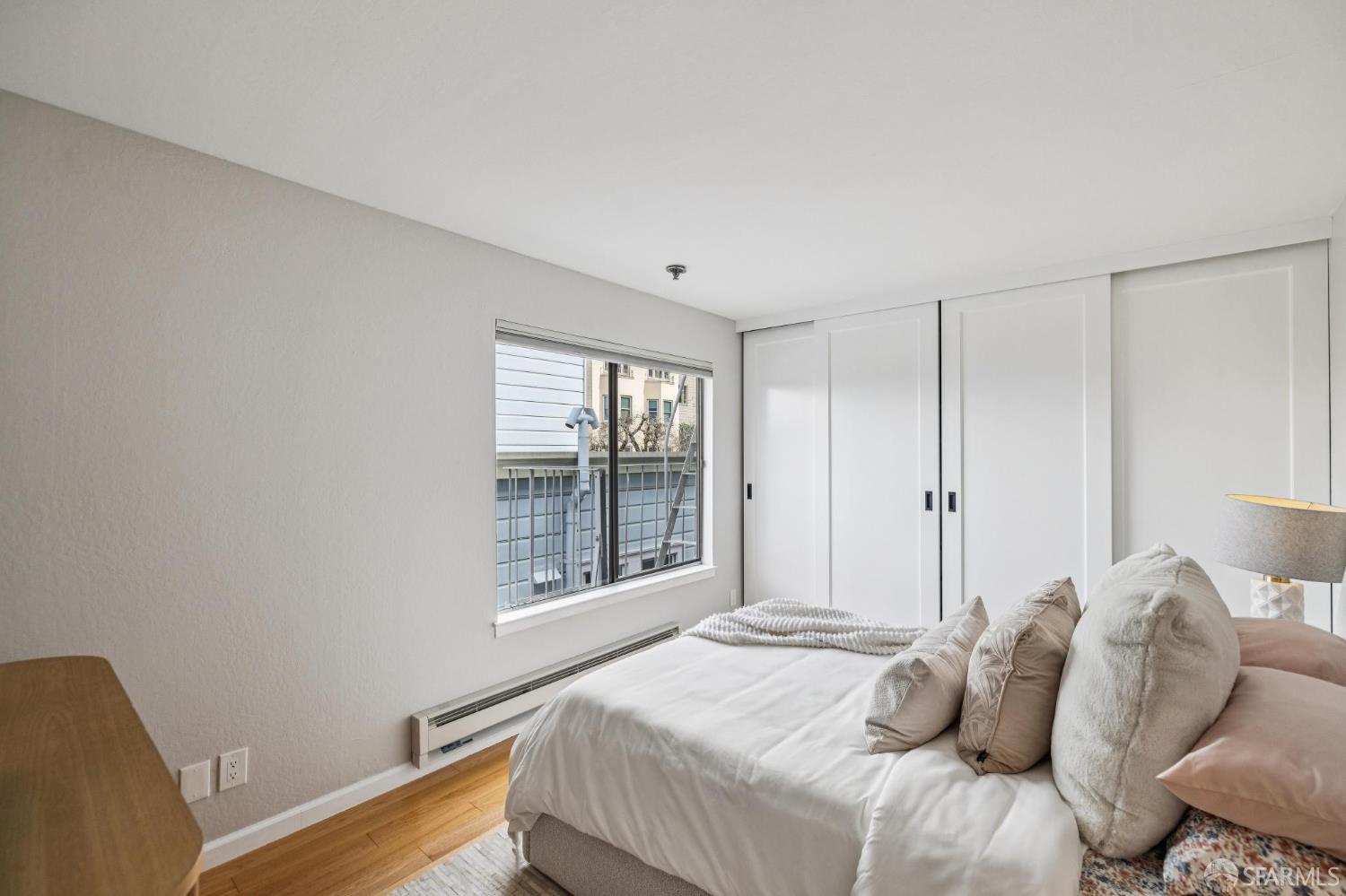 935 Filbert Street, Unit 3 San Francisco, CA 94133 - Photo 32 of 44 a bedroom with a bed and a window