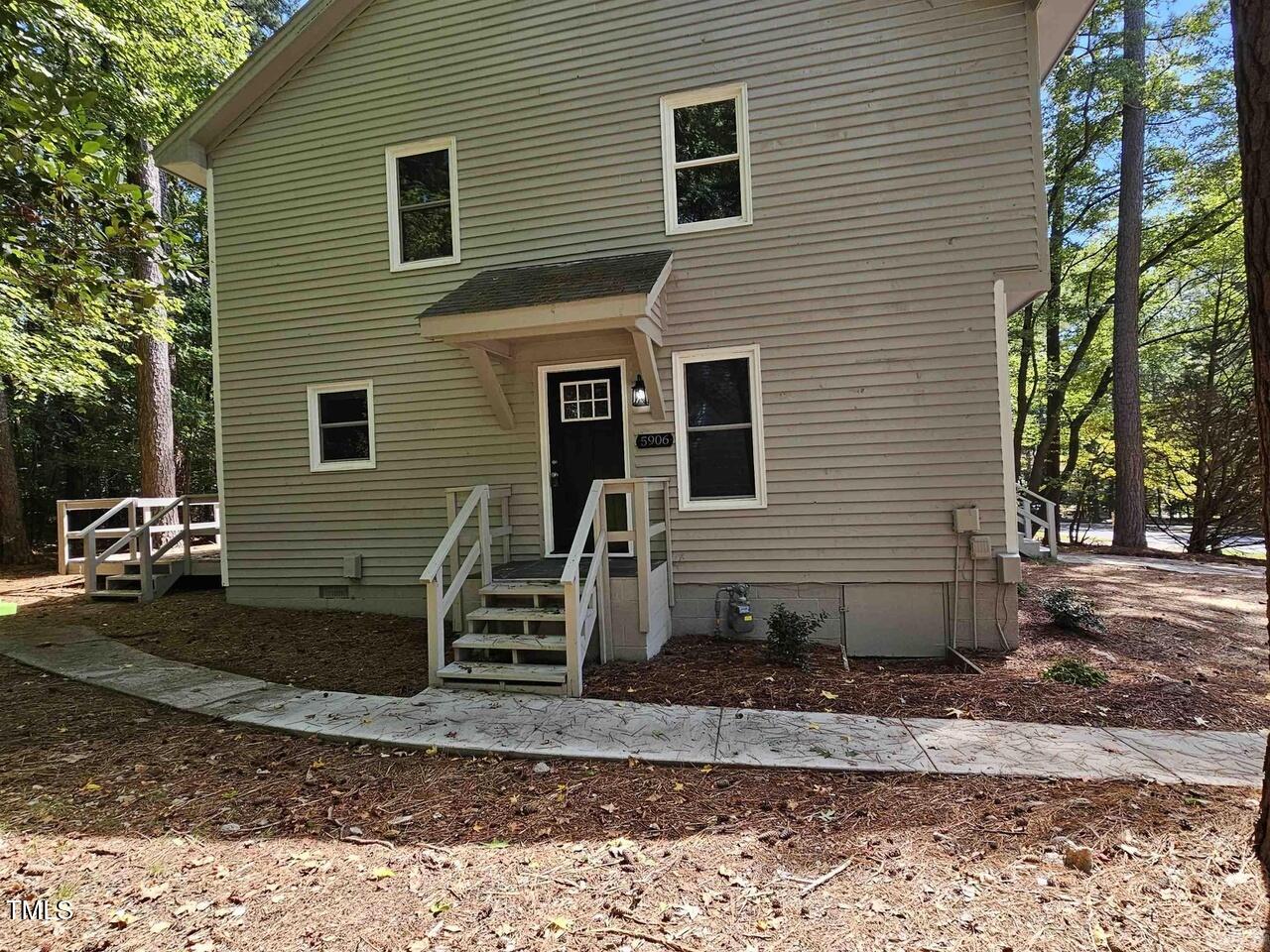 5906 Applewood Lane Raleigh, NC 27609 - Photo 12 of 14 a view of a house with a yard