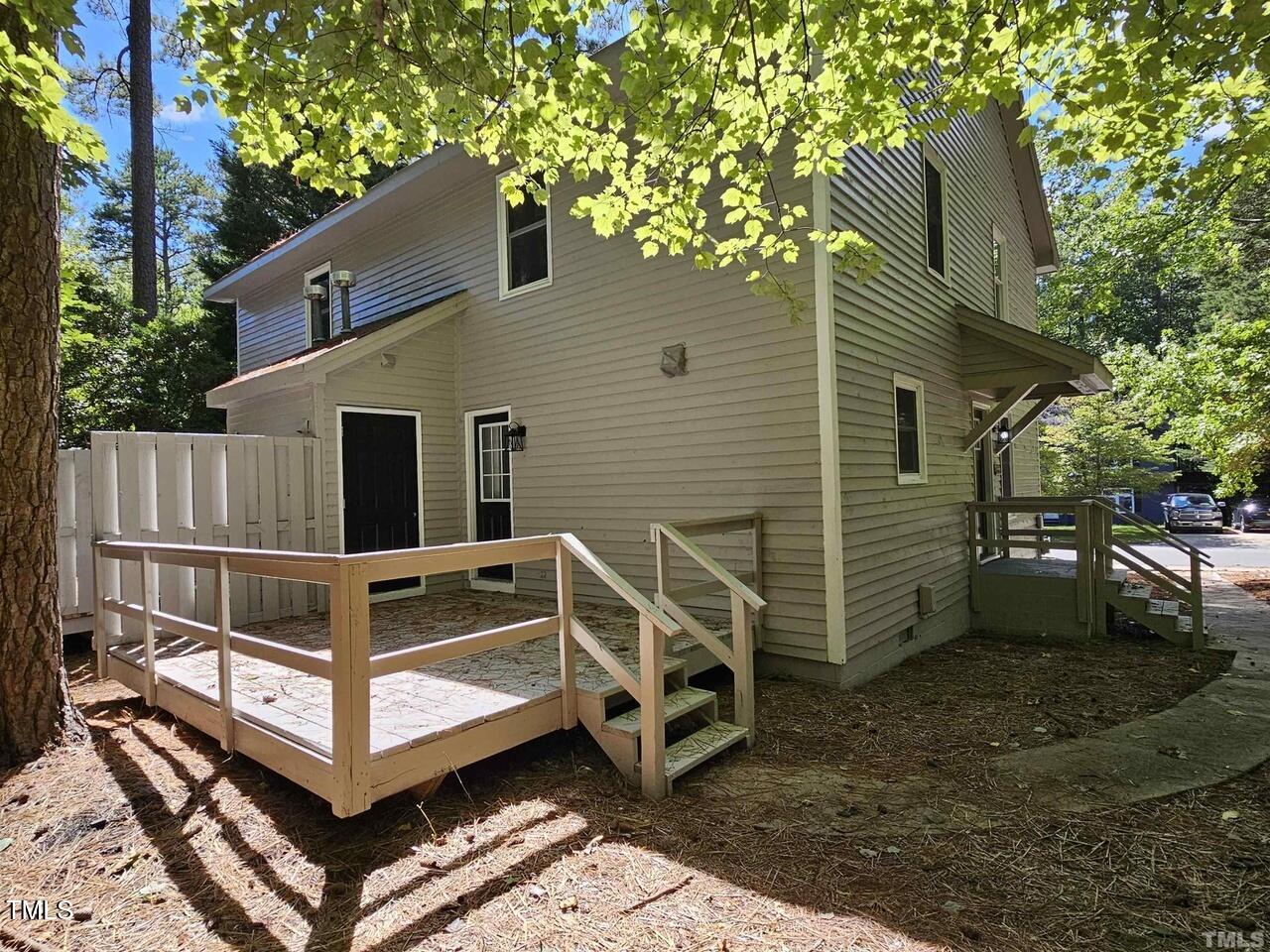 5906 Applewood Lane Raleigh, NC 27609 - Photo 14 of 14 a view of a wooden house with a yard