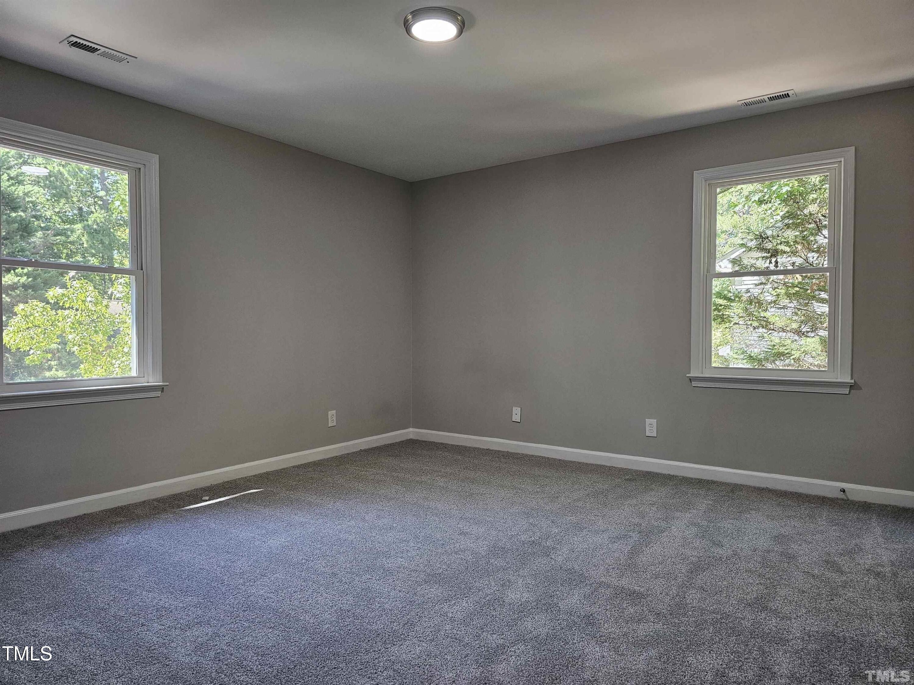 5906 Applewood Lane Raleigh, NC 27609 - Photo 7 of 14 an empty room with windows