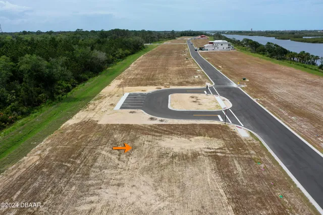 swimming pool view with a garden