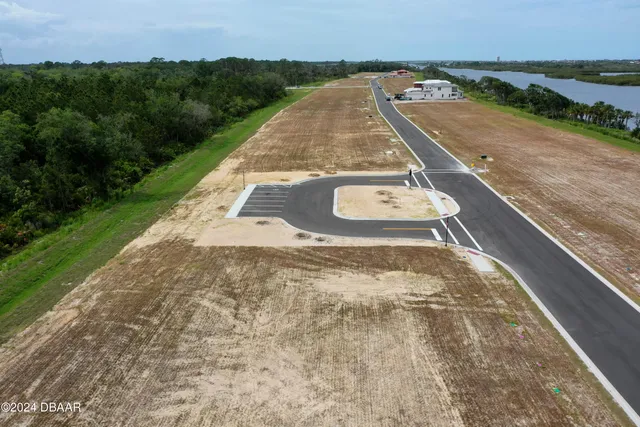a view of a swimming pool with a yard