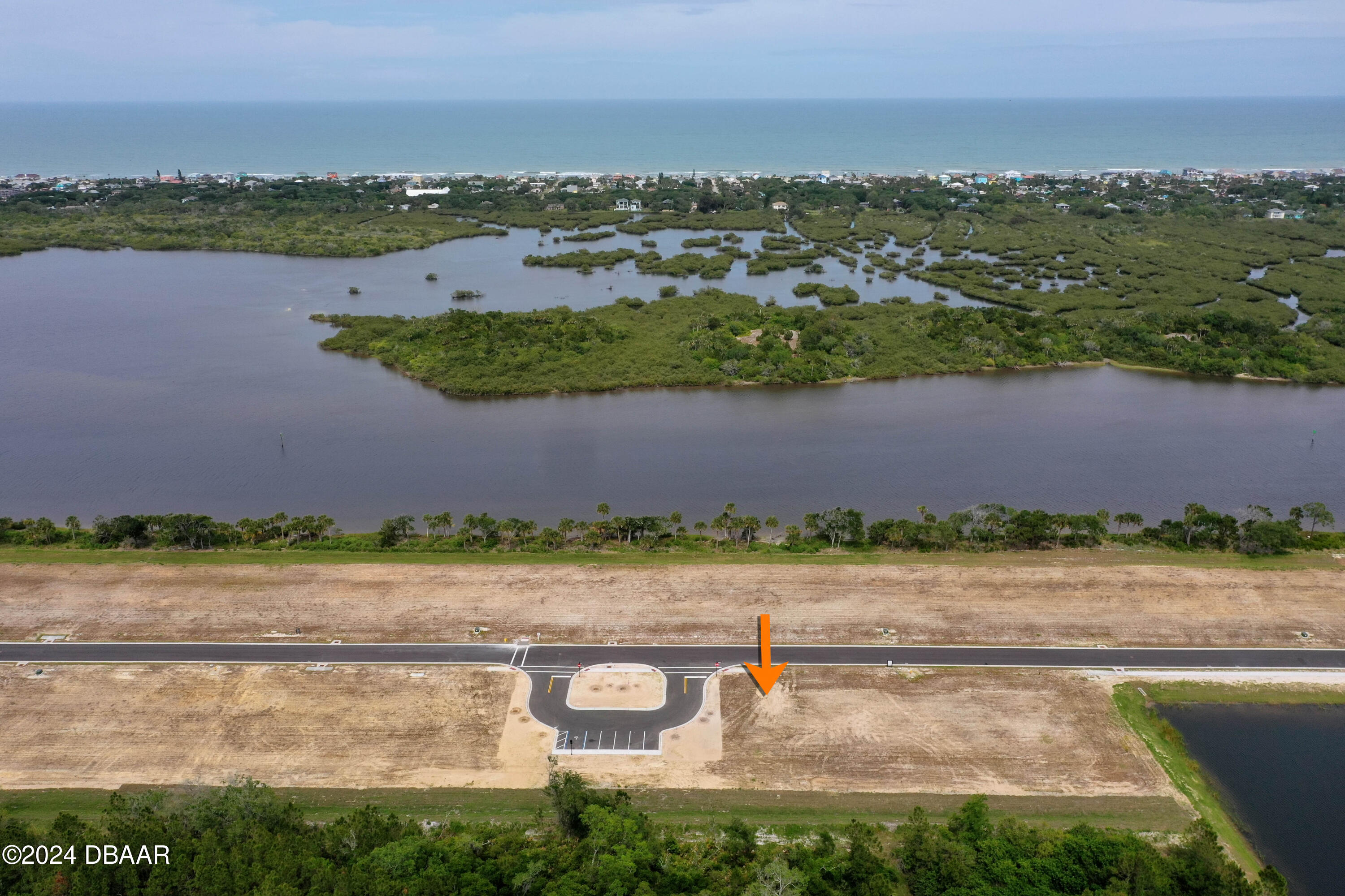 125 Coronado Road Flagler Beach, FL 32136 - Photo 35 of 46 an aerial view of a city with lots of residential buildings and ocean view