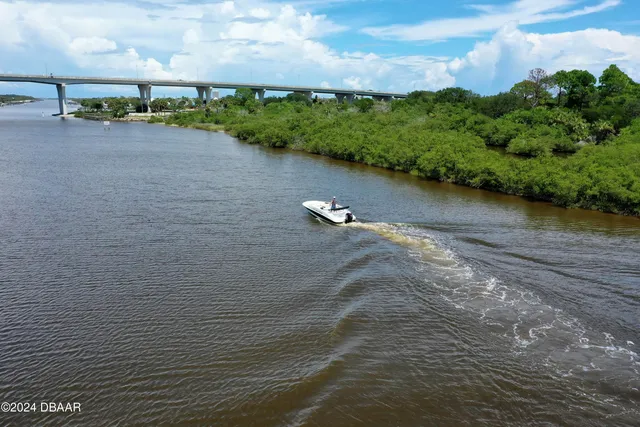an aerial view of a house with outdoor space