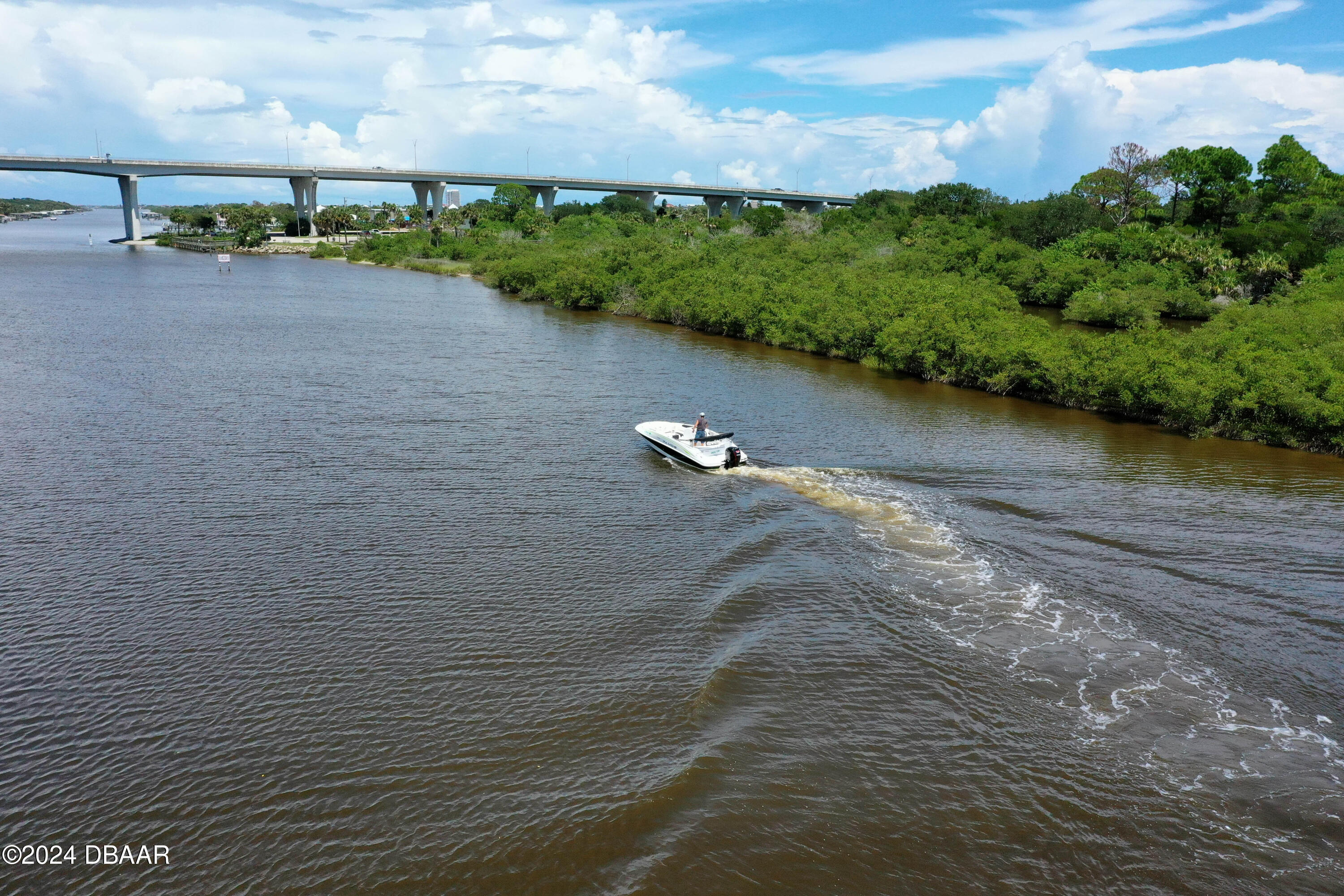 125 Coronado Road Flagler Beach, FL 32136 - Photo 41 of 46 a view of a lake with houses
