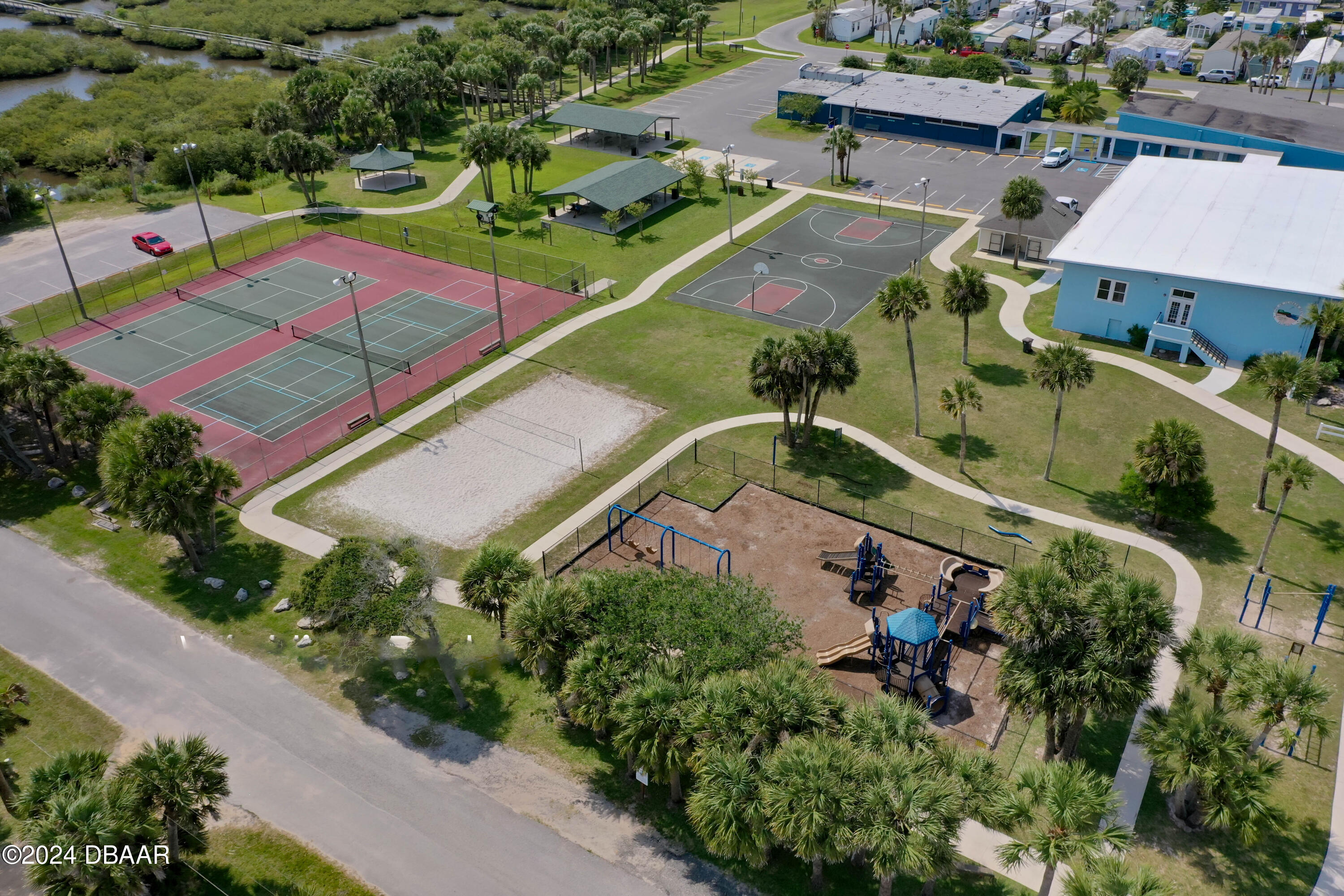125 Coronado Road Flagler Beach, FL 32136 - Photo 44 of 46 an aerial view of a tennis ground and a cars park side of the road