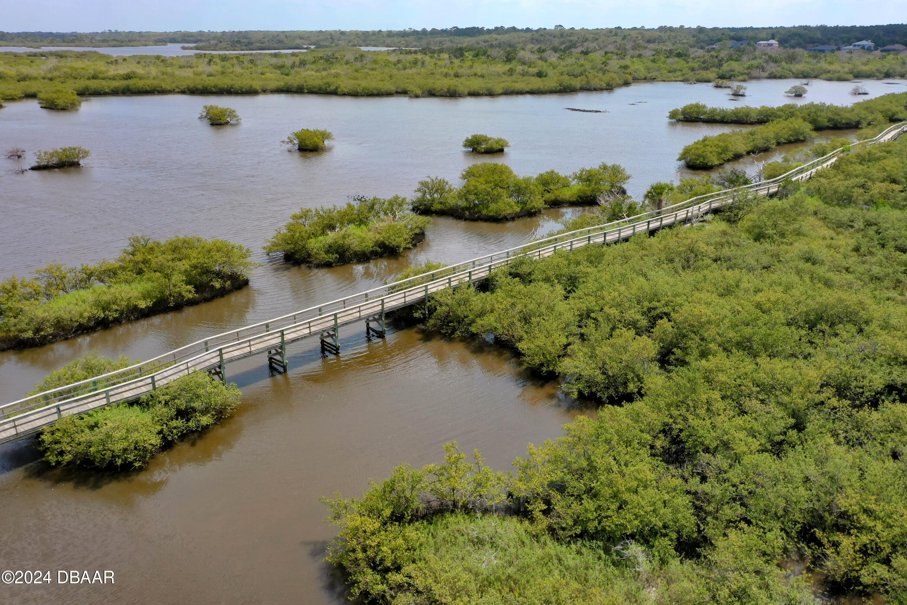 125 Coronado Road Flagler Beach, FL 32136 - Photo 46 of 46 an aerial view of a city with lake view
