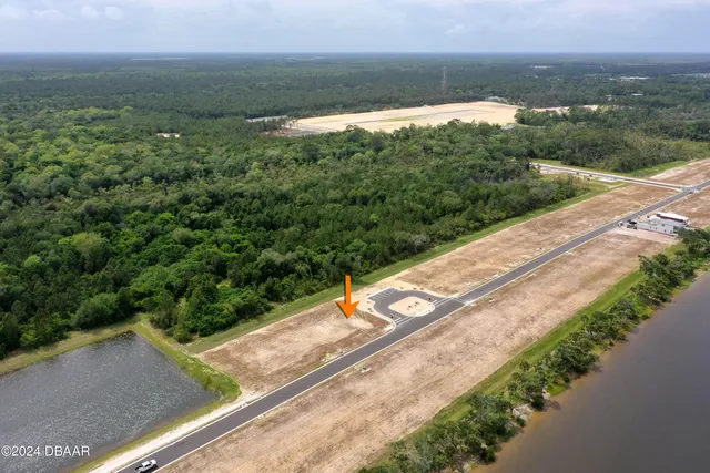 a view of a yard with an ocean view