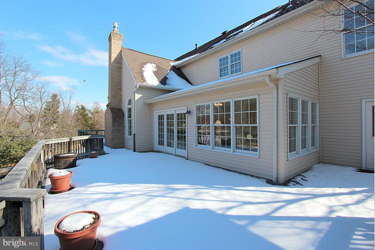 1296 Gatesmeadow Way Reston, VA 20194 - Photo 26 of 29 a view of a house with wooden floor and yard in front of it