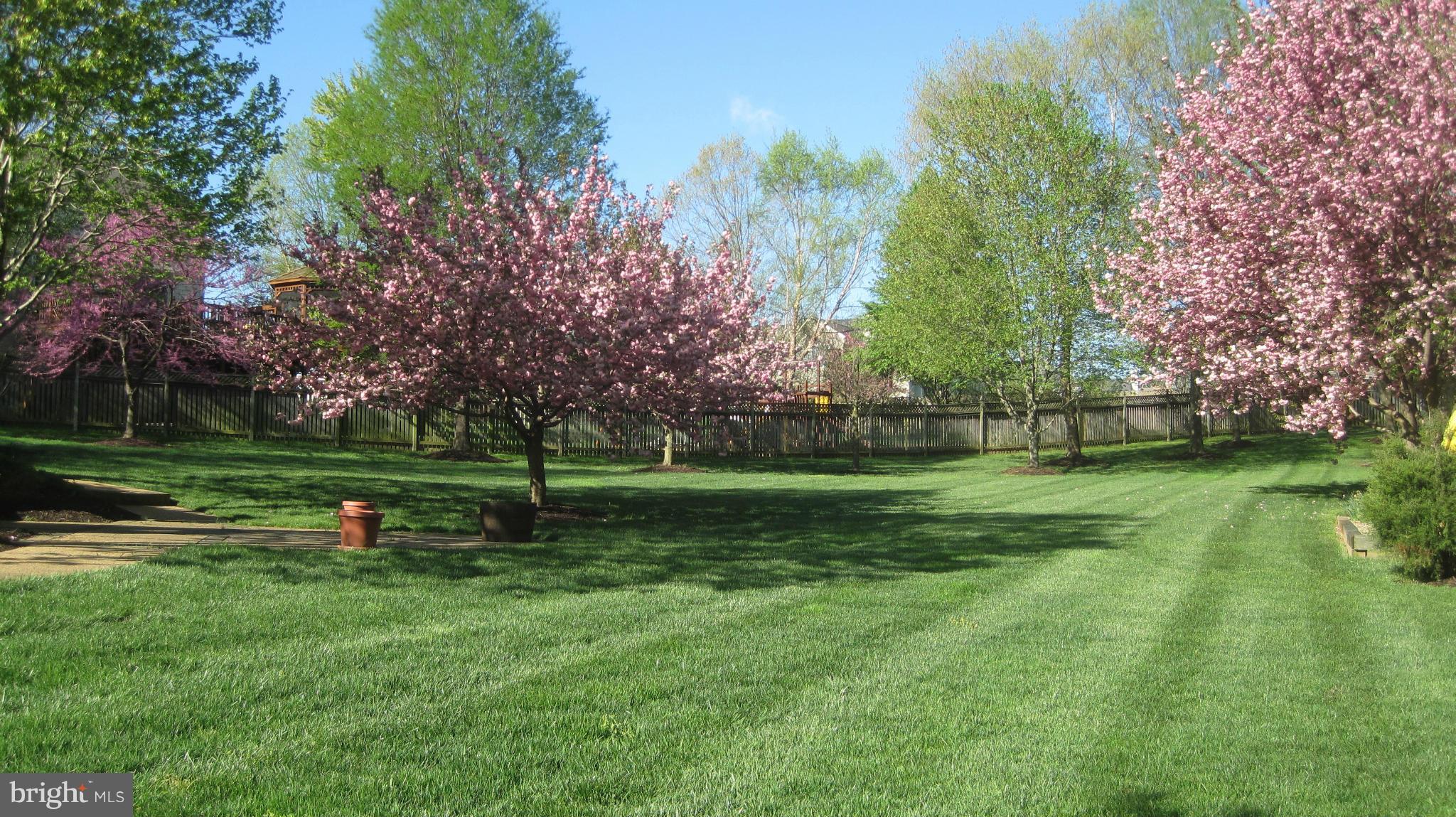 1296 Gatesmeadow Way Reston, VA 20194 - Photo 28 of 29 a view of a park with trees and wooden fence