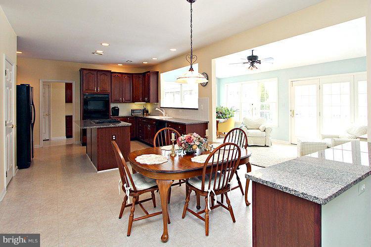 1296 Gatesmeadow Way Reston, VA 20194 - Photo 8 of 29 a view of a dining room with furniture window and outside view