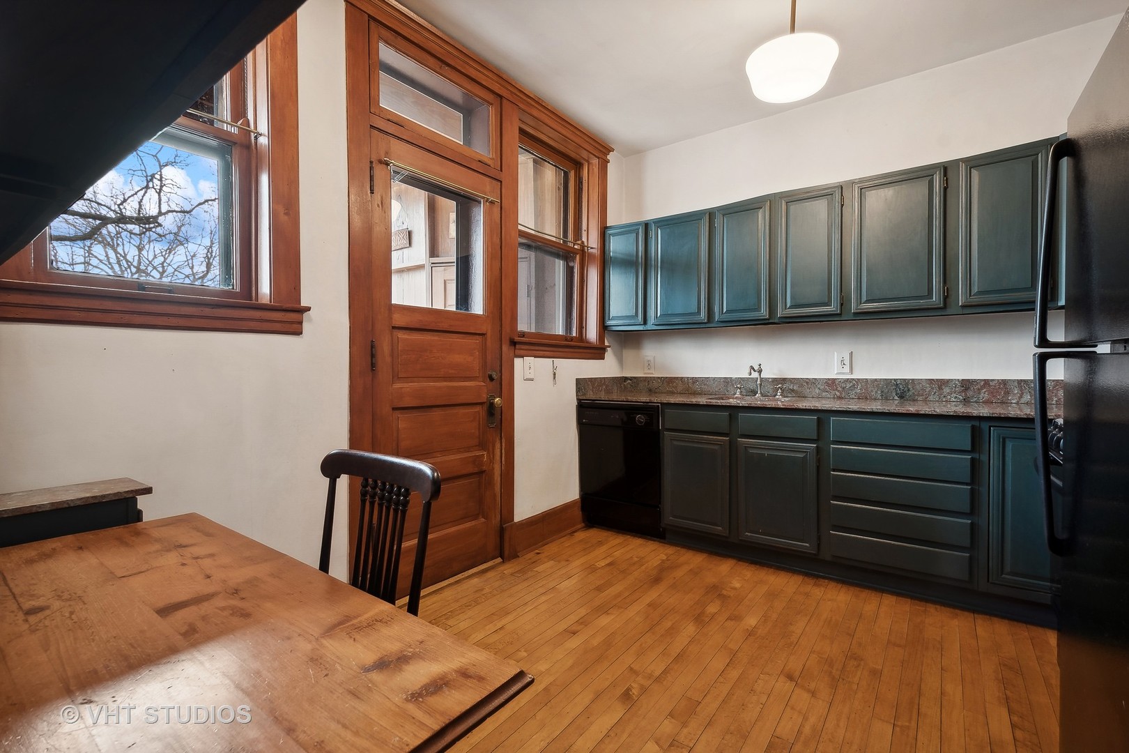 1119 Maple Avenue, Unit 2E Evanston, IL 60202 - Photo 7 of 12 a kitchen with stainless steel appliances granite countertop a stove a sink and a refrigerator