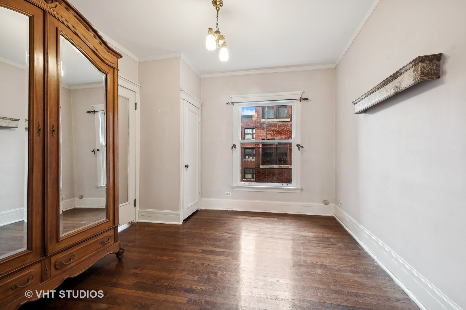 1119 Maple Avenue, Unit 2E Evanston, IL 60202 - Photo 9 of 12 wooden floor in an empty room with a window
