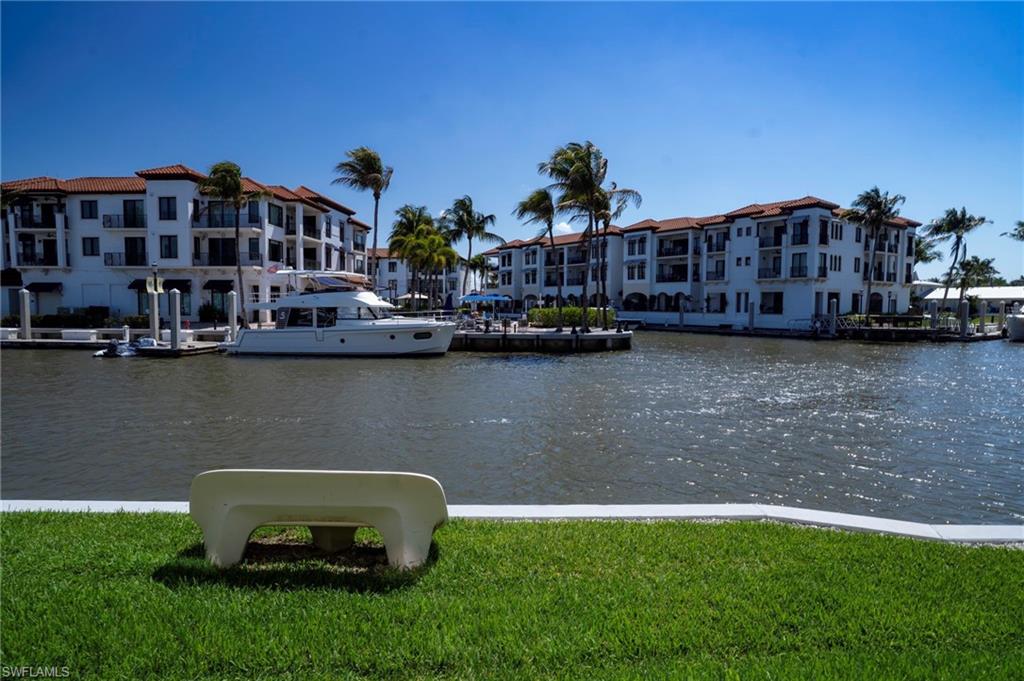 805 River Point Drive, Unit 103C Naples, FL 34102 - Photo 5 of 27 a view of a house with a yard and sitting area
